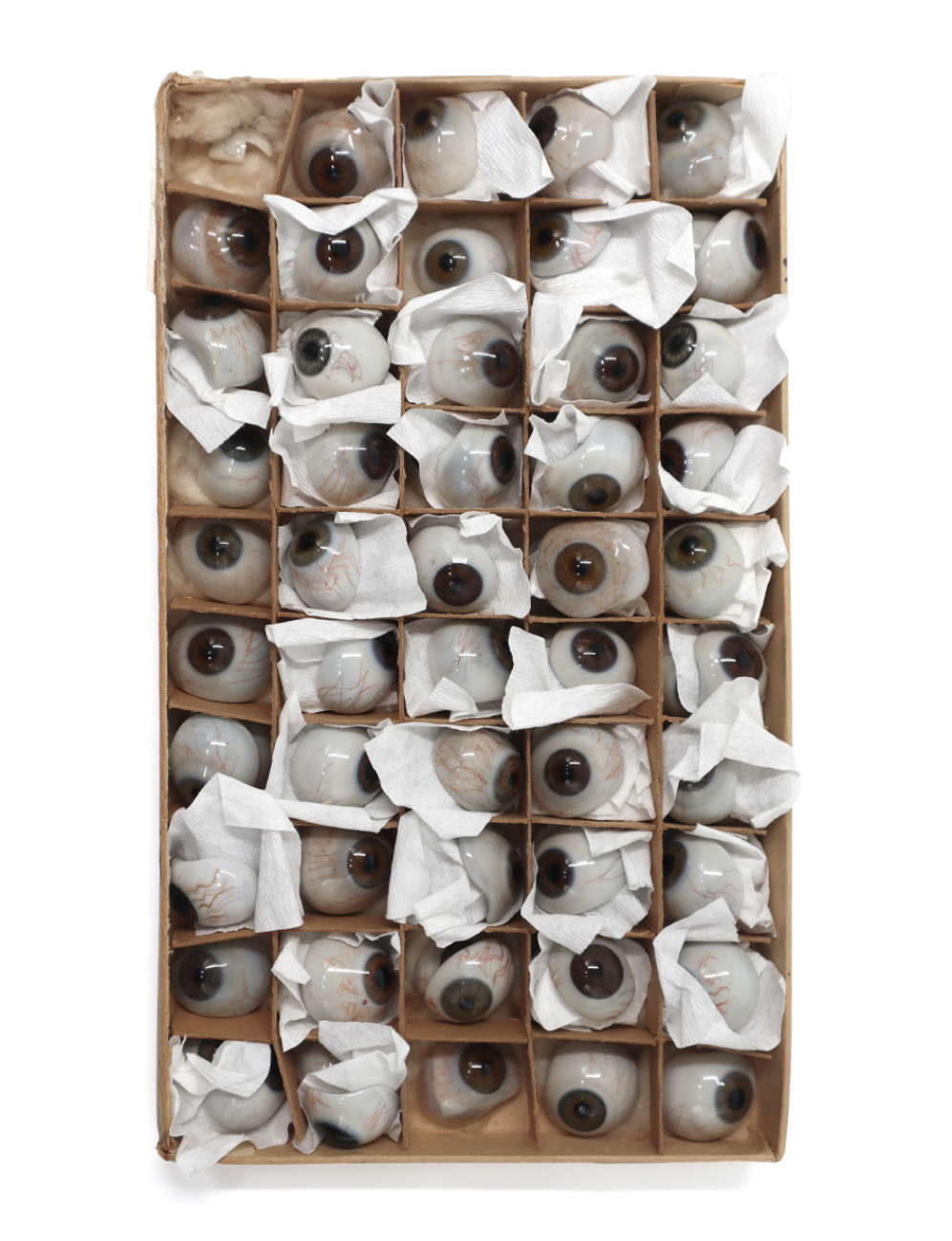 Cosmetic eye prostheses in a package.